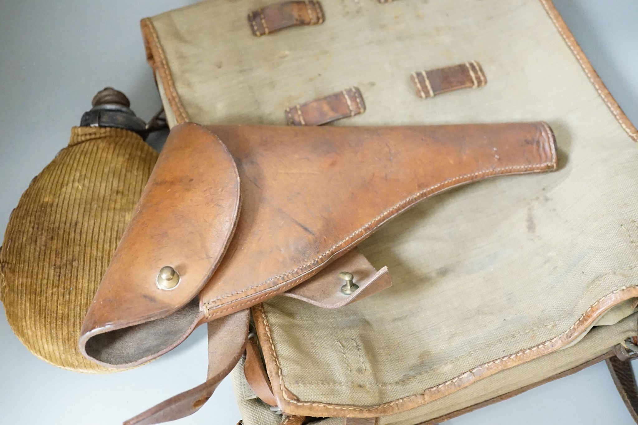 Miscellaneous WWI accessories including a water bottle, and a WWII Japanese pilot's cap